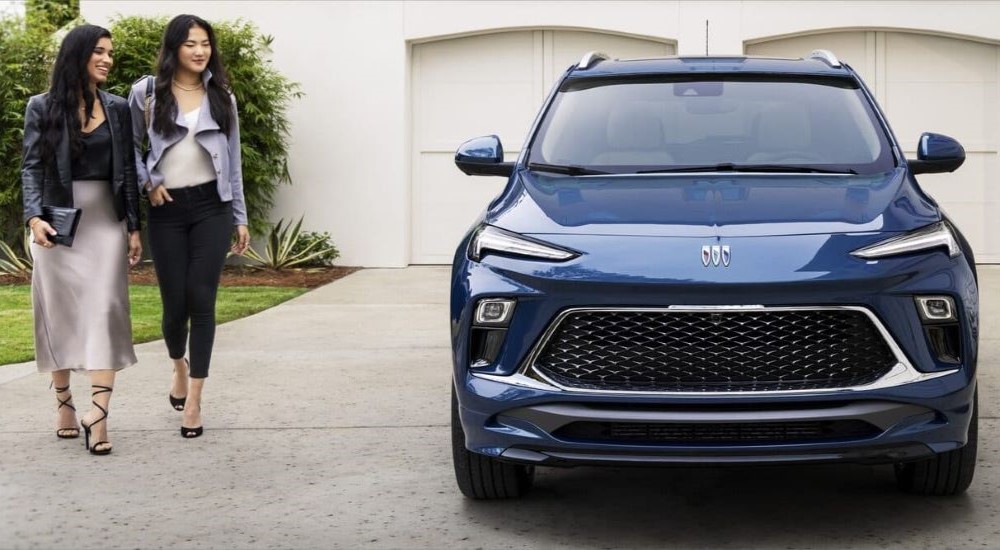 Blue 2024 Buick Encore GX Avenir parked on a driveway