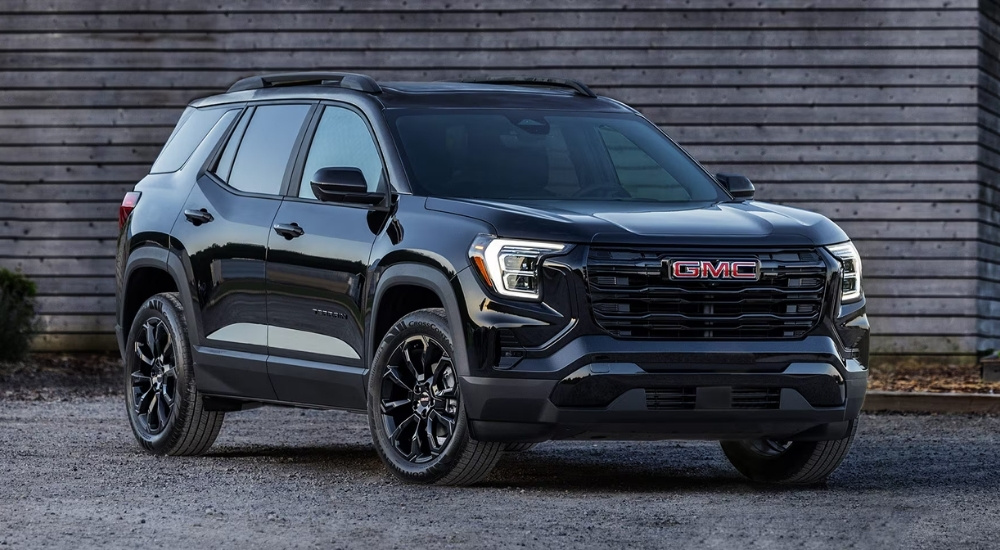 Black 2025 GMC Terrain for sale parked near a wall