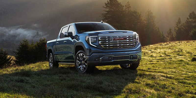 2026 GMC Sierra 1500 parked in a scenic mountain landscape