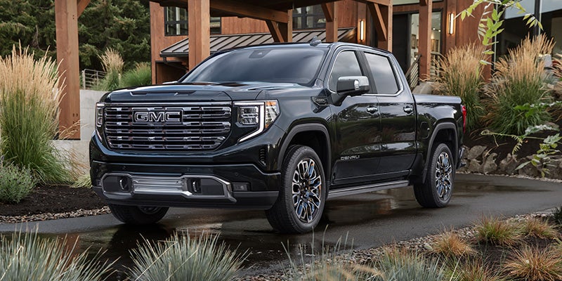 2026 GMC Sierra 1500 Denali parked outside a modern home