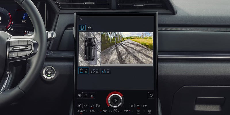 2027 GMC Terrain Elevation driving on a scenic mountain road
