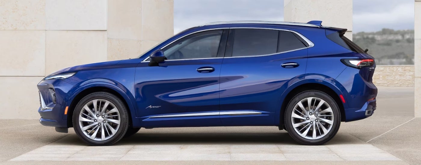 Blue 2024 Buick Envision parked at a Buick dealer near Mount Clemens