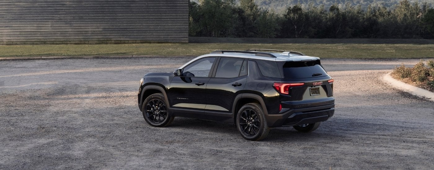 A black 2025 GMC Terrain for sale from the side.