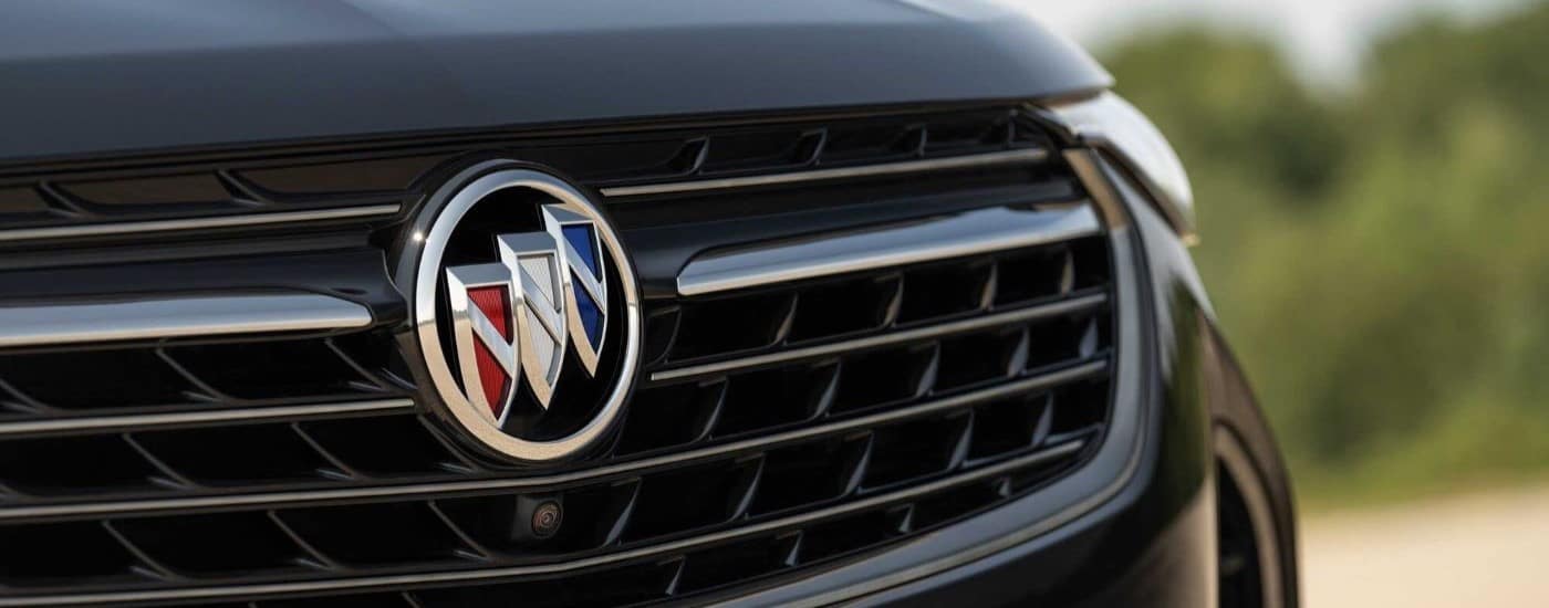 The grille on a black 2023 Buick Envision ST at a Buick dealer.