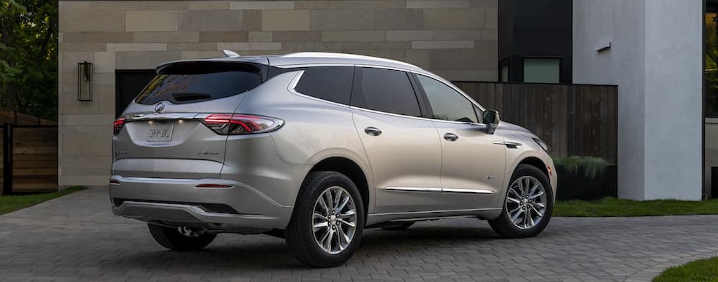 A silver 2022 Buick Enclave from the side after leaving a used Buick dealer near Mount Clemens.