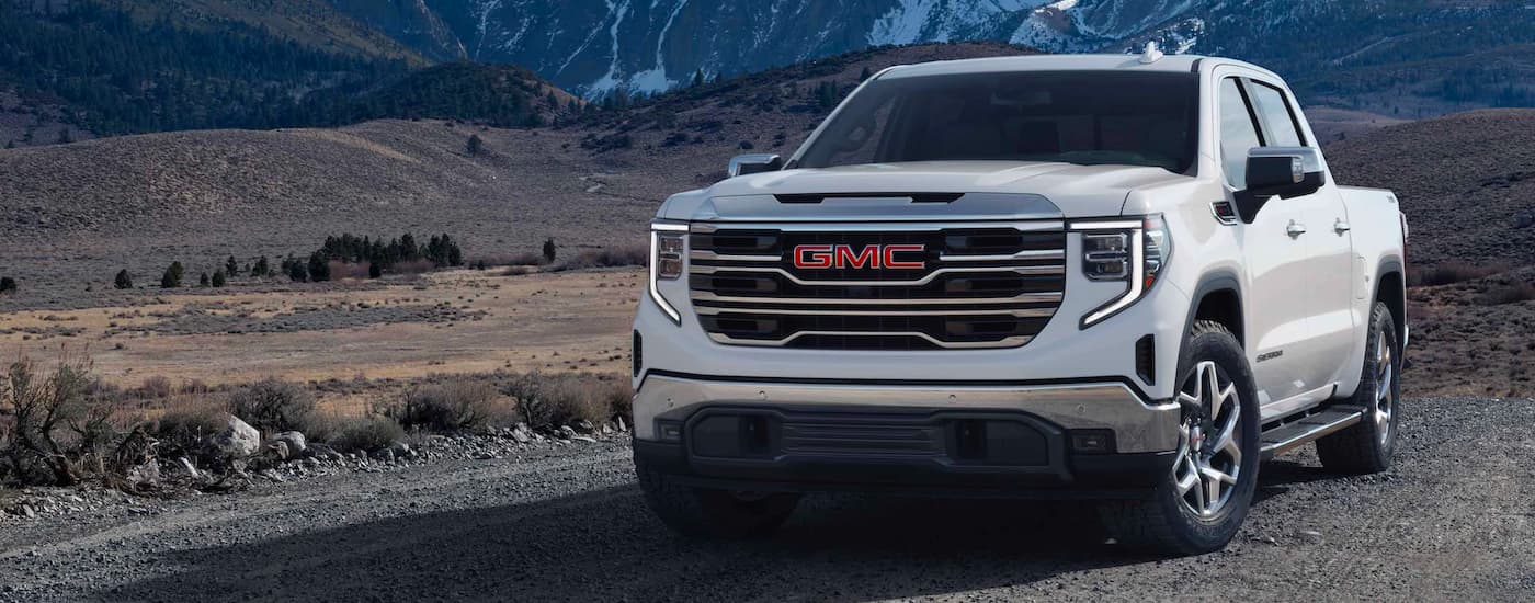 A white 2023 GMC Sierra 1500 parked off-road.